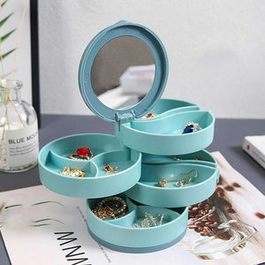 Four-layer rotating jewelry organizer box with mirror, designed for jewelry storage and easy access.